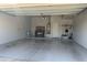 Clean and organized garage with ample storage and a workbench at 2013 E Valencia Dr, Phoenix, AZ 85042