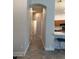 Hallway connecting the living spaces, showcasing tile flooring and neutral wall colors at 2013 E Valencia Dr, Phoenix, AZ 85042