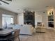 Spacious living room featuring a fireplace, large windows, and comfortable seating at 2013 E Valencia Dr, Phoenix, AZ 85042