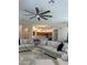 Open-concept living area with a modern kitchen, comfortable seating, and stylish lighting at 2013 E Valencia Dr, Phoenix, AZ 85042