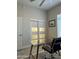 Bright office with a glass desk, rolling chair, window, and recessed lights at 2013 E Valencia Dr, Phoenix, AZ 85042