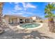 Spacious backyard with a private pool, covered patio, and plenty of room for entertaining at 209 N 237Th Ave, Buckeye, AZ 85396