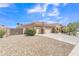 Spacious property with three car garage, a private fenced area, and low-maintenance desert landscape at 209 N 237Th Ave, Buckeye, AZ 85396