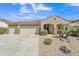 Charming home featuring a spacious three-car garage and low-maintenance desert landscaping at 209 N 237Th Ave, Buckeye, AZ 85396