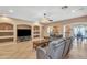 Open concept living room featuring tiled floors, comfortable seating, ceiling fan, and recessed lighting at 209 N 237Th Ave, Buckeye, AZ 85396