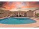 Sparkling swimming pool surrounded by a patio, perfect for outdoor entertaining and relaxation at 209 N 237Th Ave, Buckeye, AZ 85396