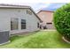 View of the home's exterior, featuring faux grass and an outdoor patio at 2326 E Spruce Dr, Chandler, AZ 85286