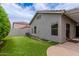 Well-maintained backyard with faux grass and a covered patio, excellent for outdoor living at 2326 E Spruce Dr, Chandler, AZ 85286