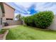 Backyard with a faux grass lawn and landscaping at 2326 E Spruce Dr, Chandler, AZ 85286