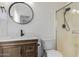 Elegant bathroom featuring wood vanity, modern faucet and hardware and glass shower at 2326 E Spruce Dr, Chandler, AZ 85286