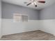 This bedroom features tile floors, neutral paint, and a ceiling fan at 2326 E Spruce Dr, Chandler, AZ 85286
