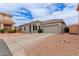 Charming single-story home with a tile roof, desert landscaping, and a two-car garage at 2326 E Spruce Dr, Chandler, AZ 85286