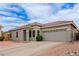 Charming single-story home with a tile roof, desert landscaping, and a two-car garage at 2326 E Spruce Dr, Chandler, AZ 85286