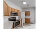 Well-equipped kitchen features modern appliances, light wood cabinets, and ample counter space at 2326 E Spruce Dr, Chandler, AZ 85286