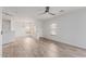 Bright, open-concept living room with wood-look tile floors and recessed lighting at 2326 E Spruce Dr, Chandler, AZ 85286