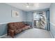 Relaxing bedroom space with a futon, sliding doors, and natural light at 3030 N Hayden Rd # 28, Scottsdale, AZ 85251