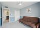 Bedroom featuring a futon, ensuite bathroom, and closet space at 3030 N Hayden Rd # 28, Scottsdale, AZ 85251