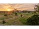 Scenic view of the golf course at sunset showcasing lush greenery and mountain views at 3030 N Hayden Rd # 28, Scottsdale, AZ 85251