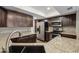 Modern kitchen with stainless steel appliances, granite countertops, and rich dark wood cabinets at 3030 N Hayden Rd # 28, Scottsdale, AZ 85251