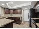 Well-maintained kitchen featuring granite countertops and sleek appliances, with access to outside at 3030 N Hayden Rd # 28, Scottsdale, AZ 85251