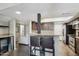 Functional kitchen featuring granite countertops with breakfast bar and modern appliances at 3030 N Hayden Rd # 28, Scottsdale, AZ 85251