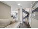 Open-concept entryway with couch, stairs and views of the dining room and living areas at 3030 N Hayden Rd # 28, Scottsdale, AZ 85251