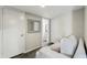 Cozy living room featuring a modern couch, a decorative mirror and access to a bathroom at 3030 N Hayden Rd # 28, Scottsdale, AZ 85251