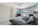 Cozy main bedroom with a fireplace, television, and access to an outdoor patio at 3030 N Hayden Rd # 28, Scottsdale, AZ 85251