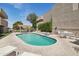 Community pool with lounge chairs and shaded dining area for residents' enjoyment at 3030 N Hayden Rd # 28, Scottsdale, AZ 85251