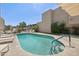 Sparkling pool surrounded by comfortable lounge chairs and a view of the complex at 3030 N Hayden Rd # 28, Scottsdale, AZ 85251
