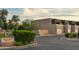 Street view of homes at 3030 Scottsdale Greens with lush landscaping and a decorative sign at 3030 N Hayden Rd # 28, Scottsdale, AZ 85251