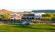 Stunning aerial view of the clubhouse and meticulously landscaped grounds and fountain creates an oasis at 31705 N 128Th Dr, Peoria, AZ 85383