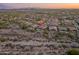 Scenic aerial view of the home showcasing the backyard pool, outdoor kitchen, and desert surroundings at 31705 N 128Th Dr, Peoria, AZ 85383