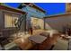 Expansive back patio featuring comfortable seating, desert landscaping and brick pavers at 31705 N 128Th Dr, Peoria, AZ 85383