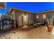 Back patio with comfortable outdoor seating and brick pavers, ideal for relaxing at 31705 N 128Th Dr, Peoria, AZ 85383