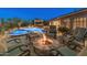 Expansive outdoor space featuring a fire pit, pool, and built-in grill, perfect for entertaining in style at 31705 N 128Th Dr, Peoria, AZ 85383