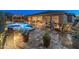 Charming outdoor area with pool, spa, fire pit, and kitchen; perfect for entertaining and enjoying the desert lifestyle at 31705 N 128Th Dr, Peoria, AZ 85383