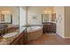 Elegant bathroom with soaking tub, granite countertops, and custom cabinetry at 31705 N 128Th Dr, Peoria, AZ 85383