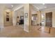 Elegant entryway showcases natural light and stylish transitional elements, setting the tone for the rest of the home at 31705 N 128Th Dr, Peoria, AZ 85383