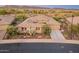 Beautiful single-story home with well manicured desert landscaping and three-car garage at 31705 N 128Th Dr, Peoria, AZ 85383