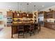Spacious kitchen featuring a large island, custom cabinets and stainless steel appliances at 31705 N 128Th Dr, Peoria, AZ 85383