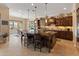 Gourmet kitchen features custom cabinetry, a large center island with seating, and luxury appliances for culinary enthusiasts at 31705 N 128Th Dr, Peoria, AZ 85383