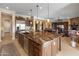 Open-concept kitchen is equipped with high-end appliances and a huge center island perfect for entertaining guests at 31705 N 128Th Dr, Peoria, AZ 85383