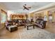 Spacious living area with comfortable leather seating and an open layout is perfect for relaxation and entertainment at 31705 N 128Th Dr, Peoria, AZ 85383