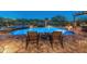 Inviting backyard pool and spa area with desert landscaping and comfortable seating, perfect for relaxing and entertaining at 31705 N 128Th Dr, Peoria, AZ 85383