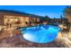 Inviting backyard pool and spa with covered patio, perfect for outdoor relaxation at 31705 N 128Th Dr, Peoria, AZ 85383