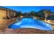 Beautiful backyard pool and spa with views, complemented by comfortable seating for outdoor relaxation and entertainment at 31705 N 128Th Dr, Peoria, AZ 85383
