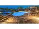 Beautiful backyard pool and spa area with an outdoor kitchen, offering a luxurious space for relaxation and entertainment at 31705 N 128Th Dr, Peoria, AZ 85383