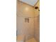 Tiled shower with a built-in niche and a shower seat, plus a modern shower head in the corner at 31705 N 128Th Dr, Peoria, AZ 85383