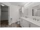 Bright bathroom with double sinks, large mirror, and storage at 3248 W Sunshine Butte Dr, San Tan Valley, AZ 85144